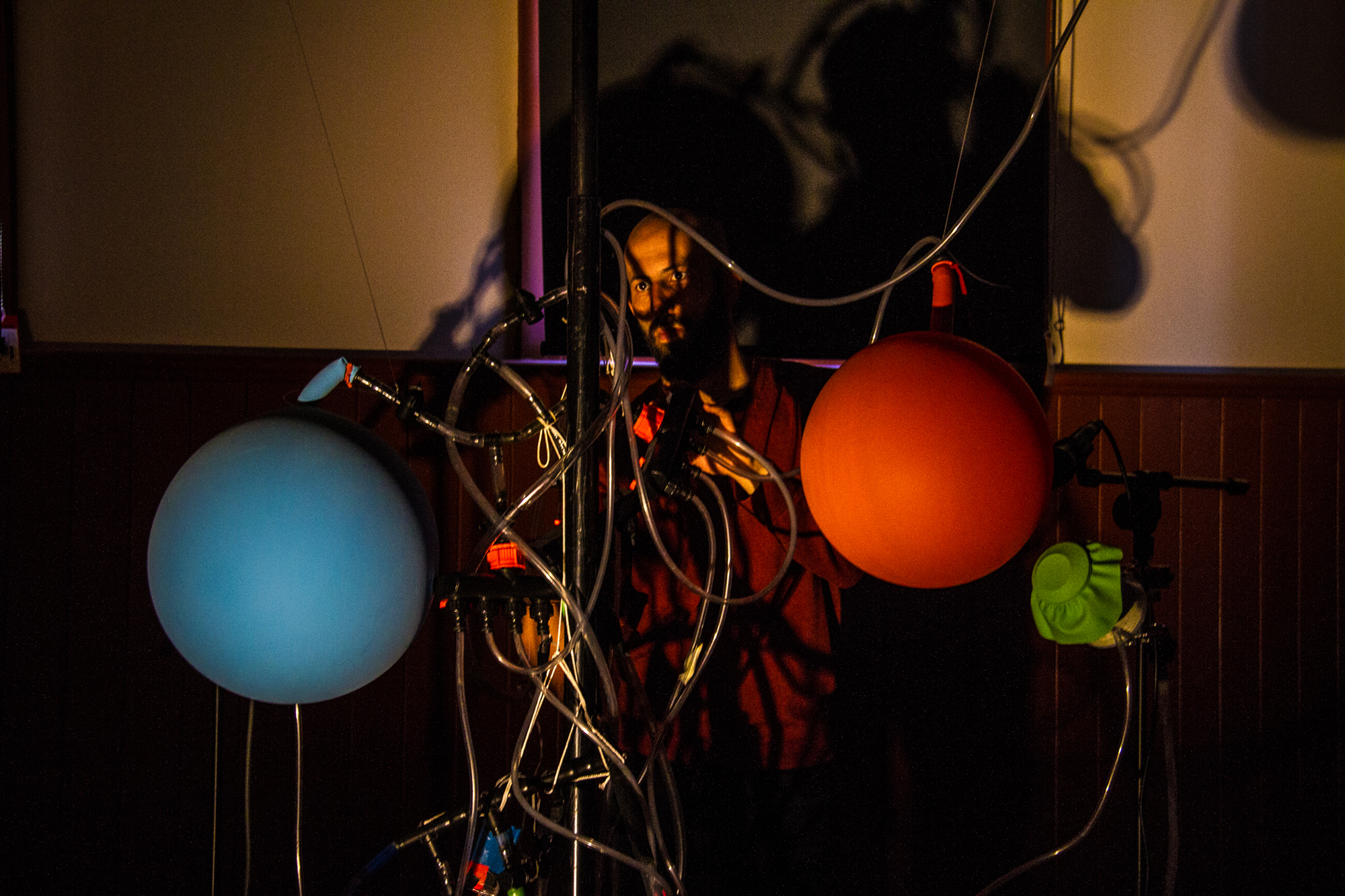 <p>Dale playing 'Switches and Hose' in a Sounds Like Movement performance for MoreArt<br> Merlynston Community Hall, Narrm/Melbourne, 2018. Photo: Lana Nyugen. </p>