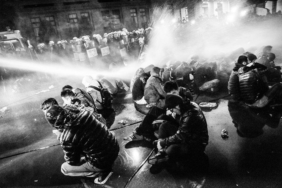 <p>Protesters attacked by water cannons on March 24, 2014. Photo: Ahuei Zhang.</p>